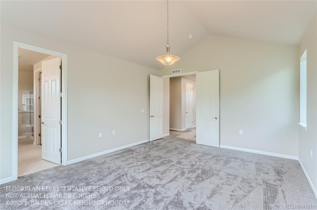 unfurnished bedroom featuring light carpet, baseboards, visible vents, and lofted ceiling