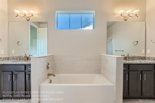 full bathroom featuring a garden tub, two vanities, and a sink