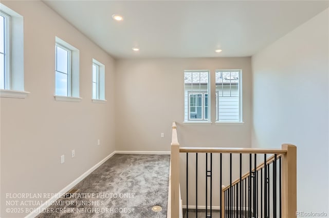 spare room with recessed lighting, carpet flooring, and baseboards