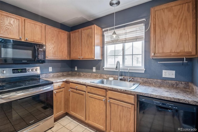 kitchen featuring black appliances, a sink, light tile patterned flooring, and pendant lighting