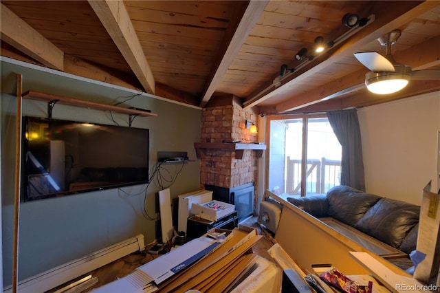 living room with a baseboard heating unit, a large fireplace, beamed ceiling, and wooden ceiling