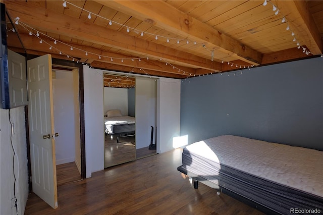 bedroom featuring beam ceiling, wooden ceiling, and hardwood / wood-style flooring