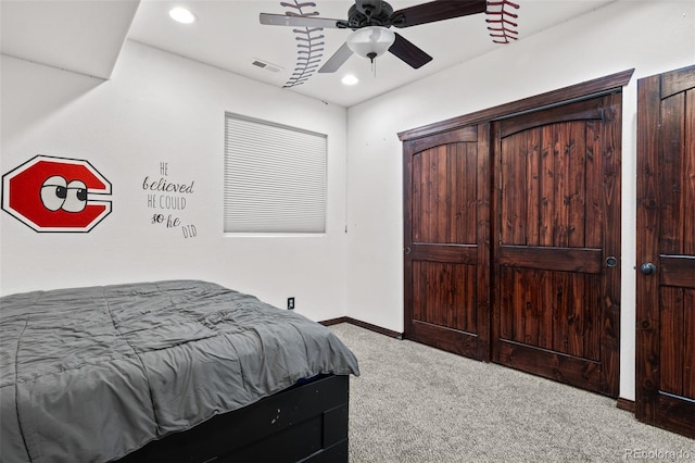 carpeted bedroom with ceiling fan