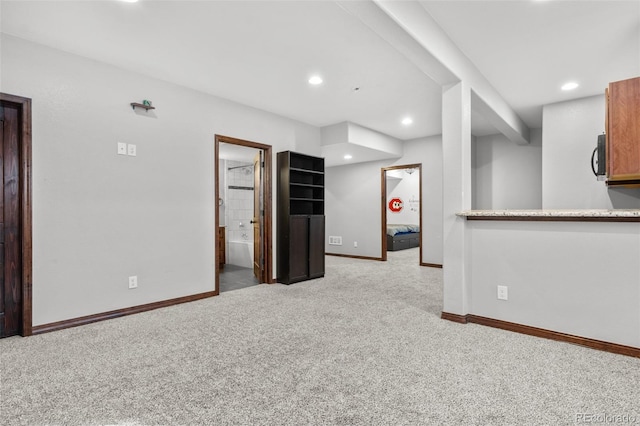 unfurnished room with light carpet