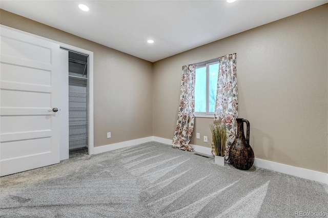 unfurnished bedroom featuring light colored carpet