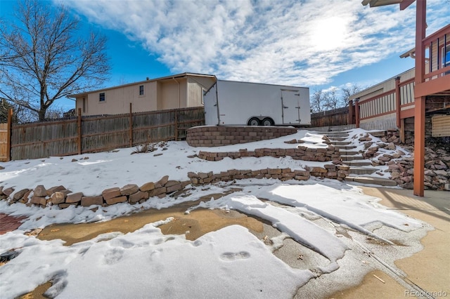 view of yard layered in snow