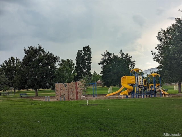 communal playground featuring a yard