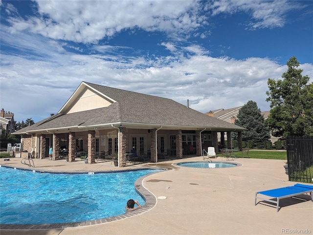 pool featuring french doors, a patio, and fence