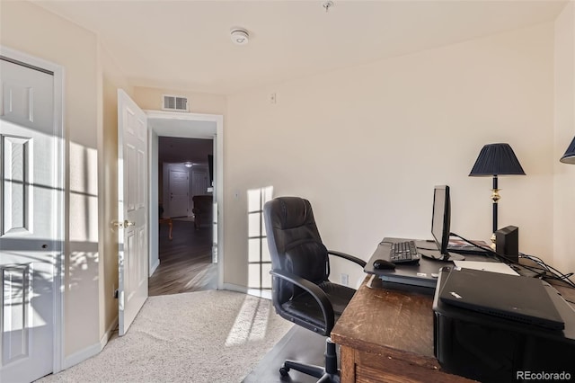 office area featuring visible vents and baseboards