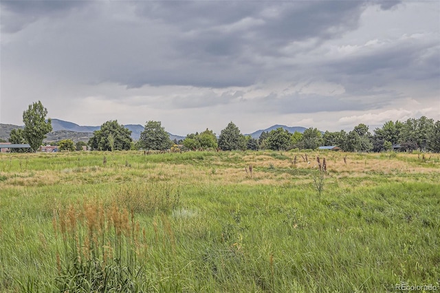 view of nature with a rural view and a mountain view