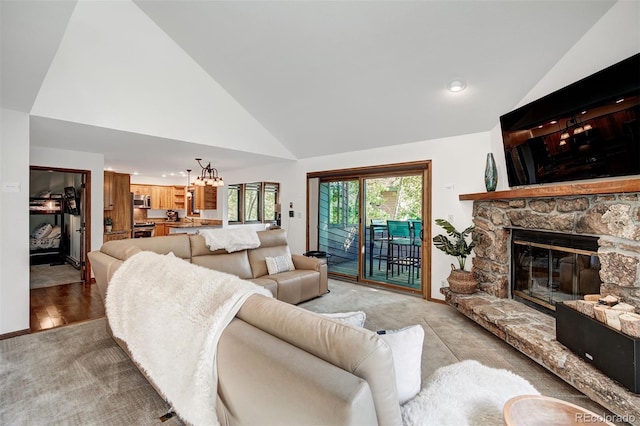180 Nottingham Rd Unit C, Avon, CO 81620 - living room featuring high vaulted ceiling, light carpet, a fireplace, recessed lighting, and a chandelier