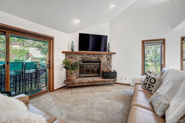 180 Nottingham Rd Unit C, Avon, CO 81620 - carpeted living area featuring lofted ceiling, healthy amount of natural light, a fireplace, and recessed lighting