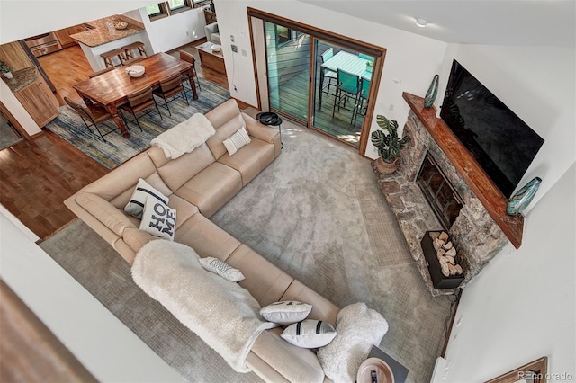 180 Nottingham Rd Unit C, Avon, CO 81620 - living area featuring a stone fireplace and wood finished floors