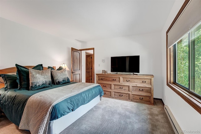 180 Nottingham Rd Unit C, Avon, CO 81620 - bedroom with a baseboard radiator and light colored carpet