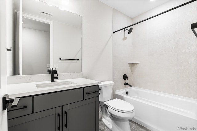 bathroom with toilet, visible vents, bathing tub / shower combination, and vanity