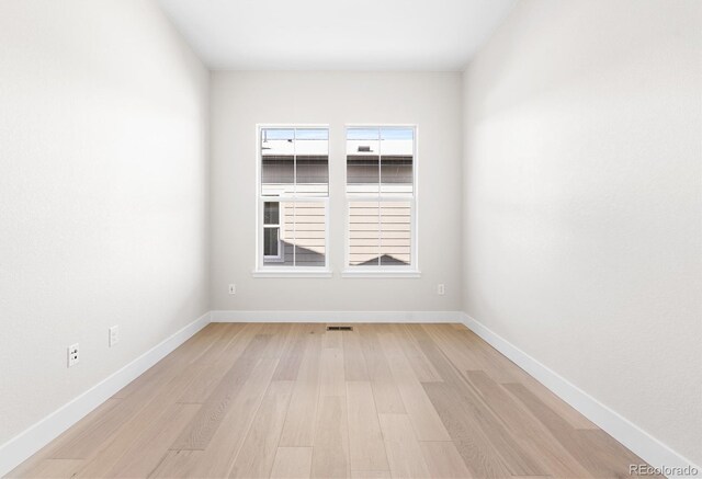6675 Fawn Path Ln, Castle Pines, CO 80108 - spare room featuring baseboards and light wood-type flooring
