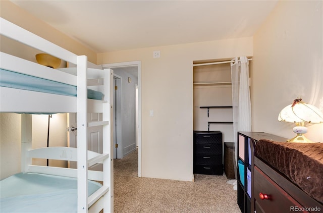 carpeted bedroom with a closet