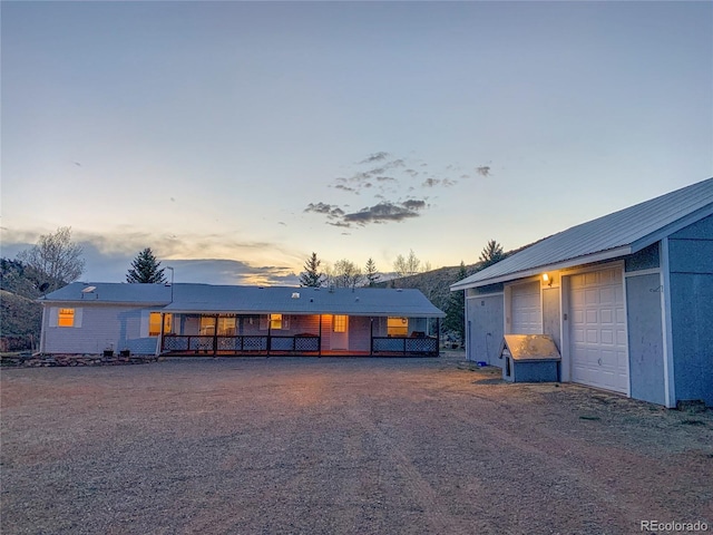 view of front of home with a garage and covered porch