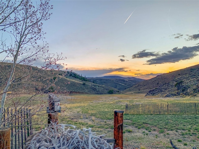 property view of mountains featuring a rural view