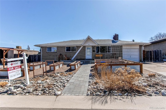 single story home with driveway, a vegetable garden, a chimney, and fence