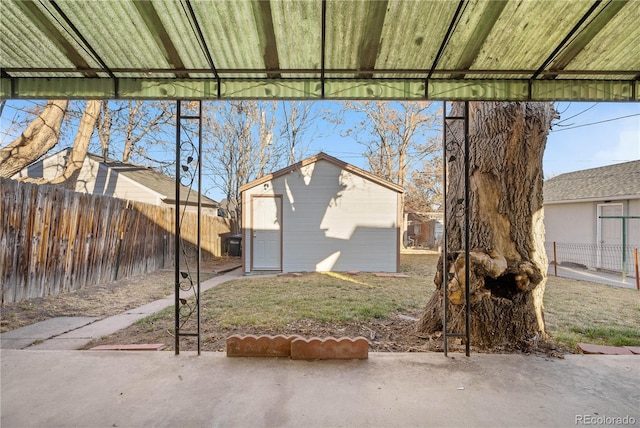 view of yard with an outbuilding and fence