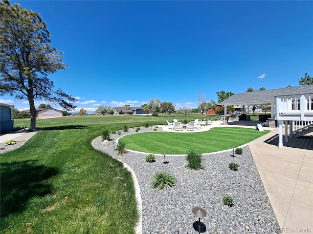 15945 Delta Ct, Brighton, CO 80603 - view of grassy yard with a patio