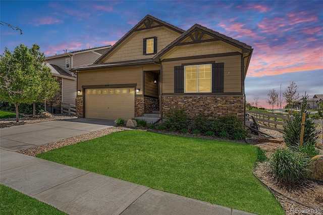 3480 Mount Powell Dr, Broomfield, CO 80023 - craftsman-style home with a garage, a front lawn, fence, stone siding, and driveway