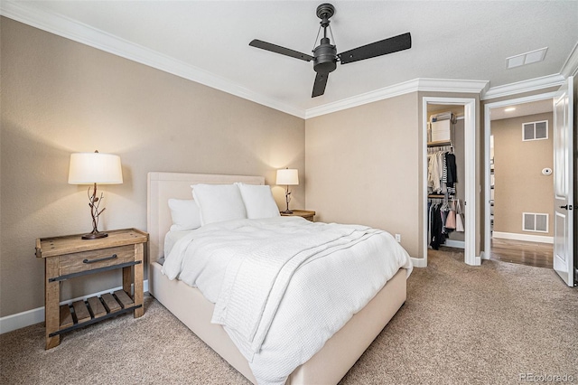 3480 Mount Powell Dr, Broomfield, CO 80023 - carpeted bedroom with crown molding, a spacious closet, a closet, and visible vents