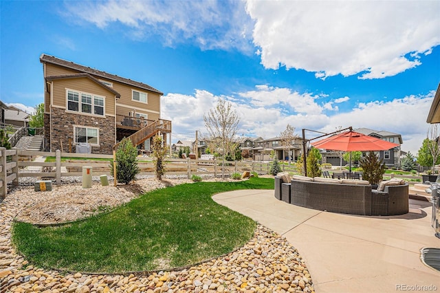 3480 Mount Powell Dr, Broomfield, CO 80023 - surrounding community with an outdoor living space, fence private yard, a patio area, stairway, and a yard
