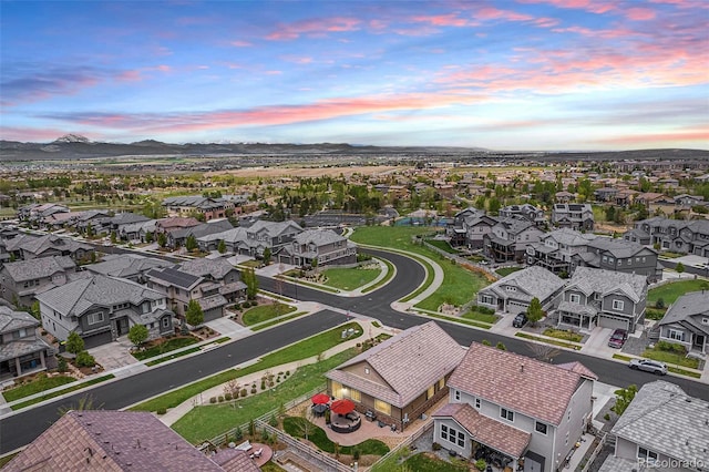 3480 Mount Powell Dr, Broomfield, CO 80023 - aerial view at dusk with a residential view and a mountain view