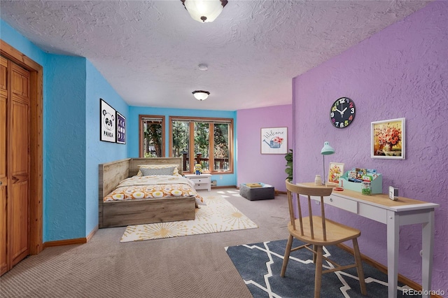 carpeted bedroom featuring a textured ceiling, a textured wall, and baseboards