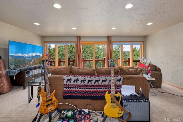 carpeted living room featuring a wealth of natural light, a textured wall, a textured ceiling, and recessed lighting