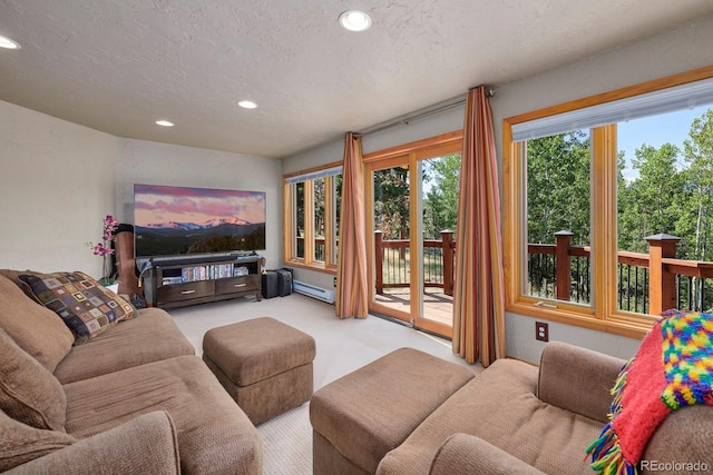 living area featuring light carpet, baseboard heating, a textured ceiling, and recessed lighting