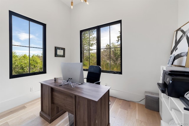 home office with light wood-type flooring