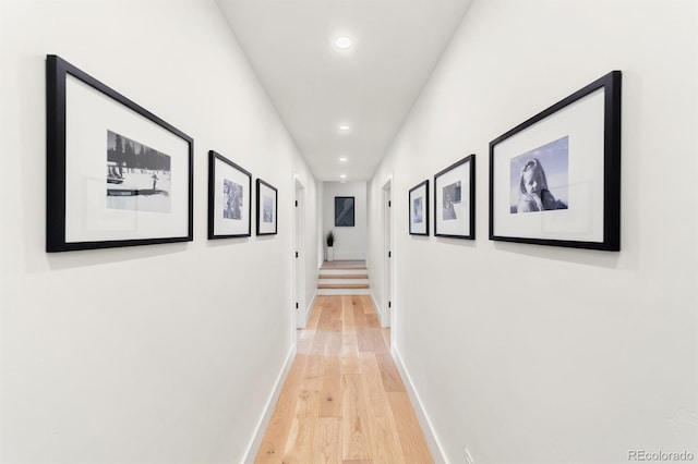 hall with light hardwood / wood-style floors