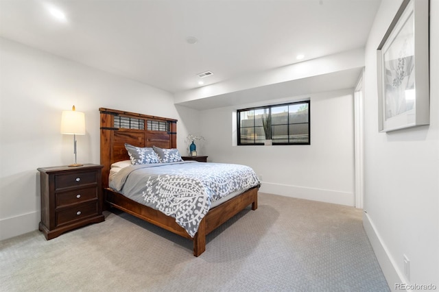 bedroom featuring light colored carpet