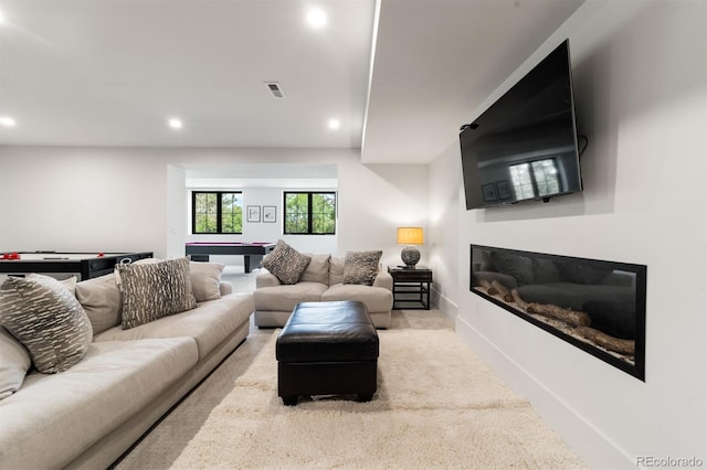 living room featuring light carpet and billiards