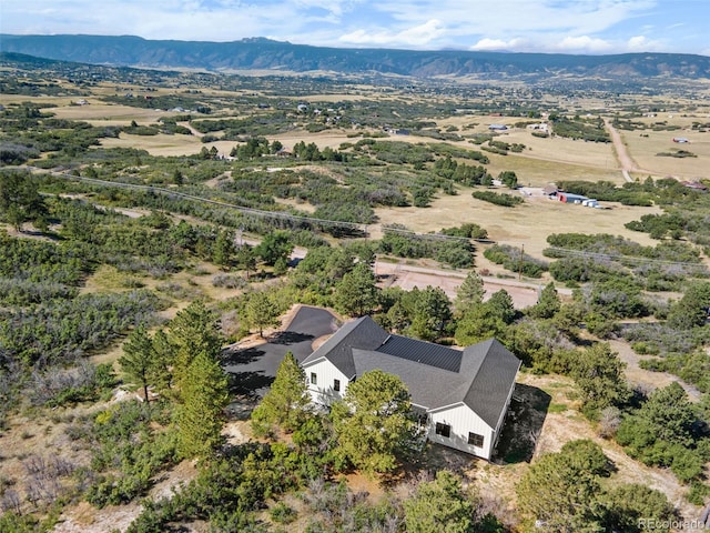 birds eye view of property with a mountain view