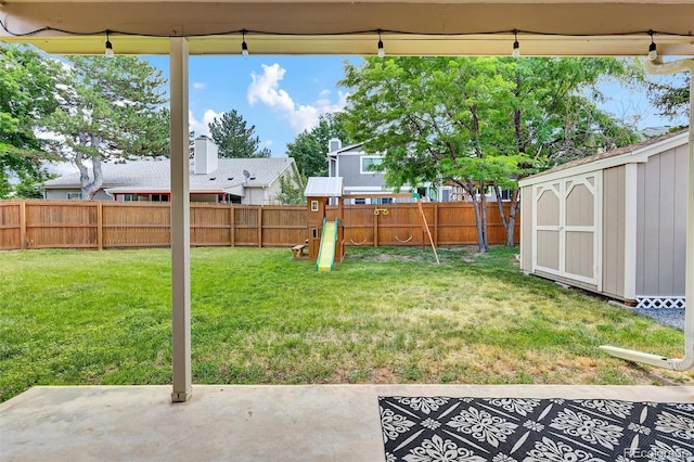3973 S Joplin Way, Aurora, CO 80013 - fenced backyard featuring a patio, a playground, and a storage unit