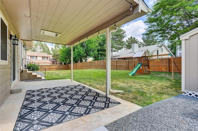 3973 S Joplin Way, Aurora, CO 80013 - fenced backyard with a patio area and a playground
