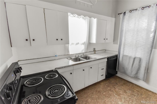 kitchen with sink, white cabinets, black appliances, and a healthy amount of sunlight