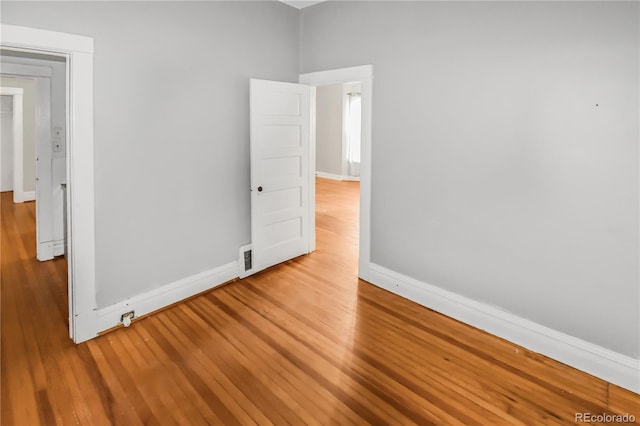 unfurnished room with light hardwood / wood-style flooring