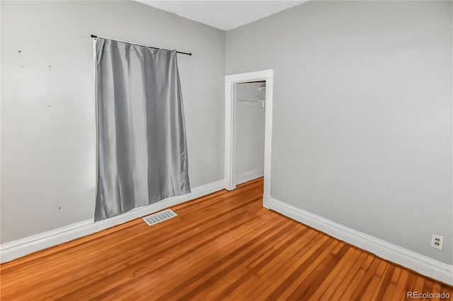 spare room featuring hardwood / wood-style flooring