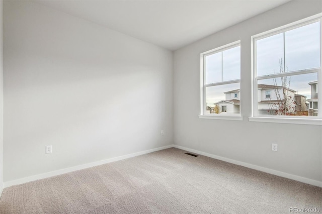 1321 Loraine Cir N, Lafayette, CO 80026 - carpeted spare room featuring visible vents and baseboards