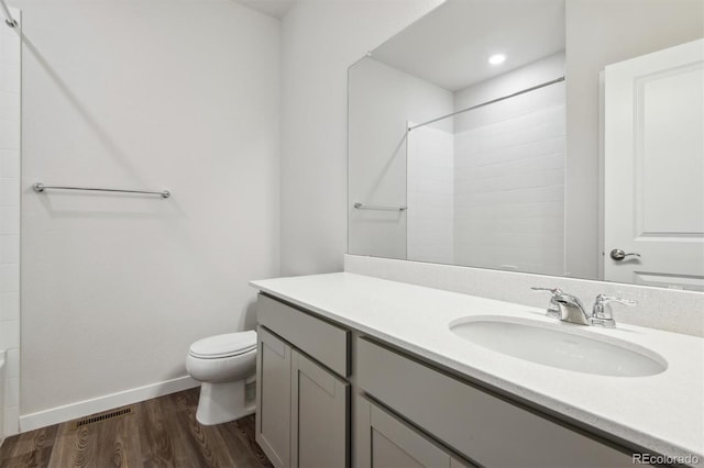 1321 Loraine Cir N, Lafayette, CO 80026 - full bath featuring visible vents, toilet, wood finished floors, walk in shower, and vanity