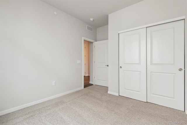 1321 Loraine Cir N, Lafayette, CO 80026 - unfurnished bedroom featuring baseboards, a closet, visible vents, and light colored carpet