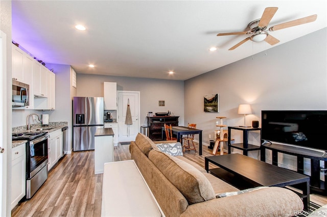 262 S 4th Ct, Deer Trail, CO 80105 - living room with recessed lighting, light wood finished floors, and a ceiling fan