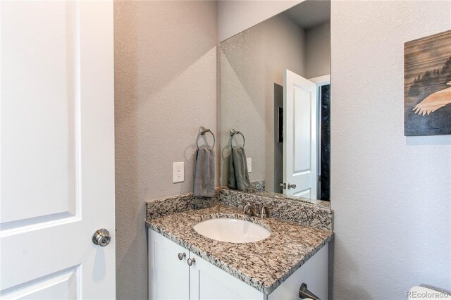 262 S 4th Ct, Deer Trail, CO 80105 - bathroom with vanity and a textured wall