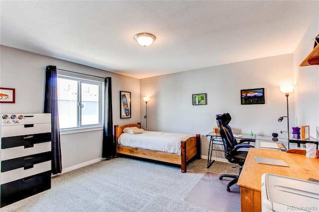 262 S 4th Ct, Deer Trail, CO 80105 - bedroom with carpet flooring, a desk, and a textured ceiling