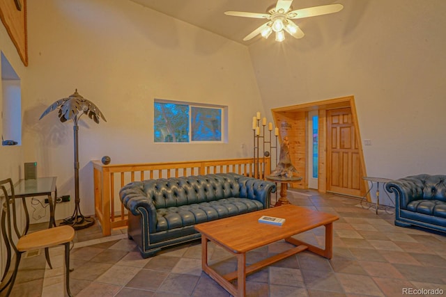 tiled living room with high vaulted ceiling and ceiling fan